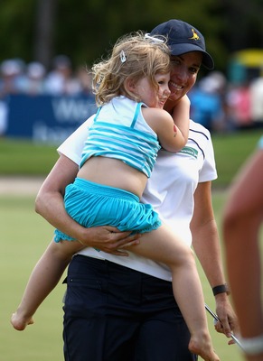 Karrie with her niece Olivia as she ran out onto the 18th Green after the final round.
